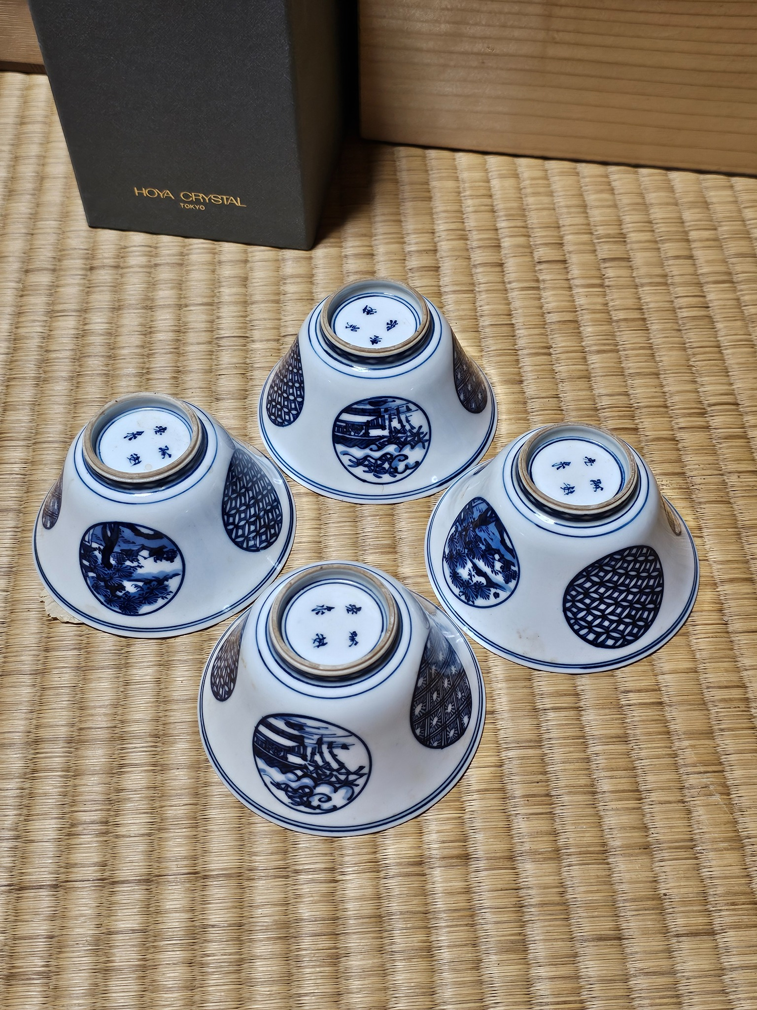 Grouped blue and white bowls from the Hanasaki house.