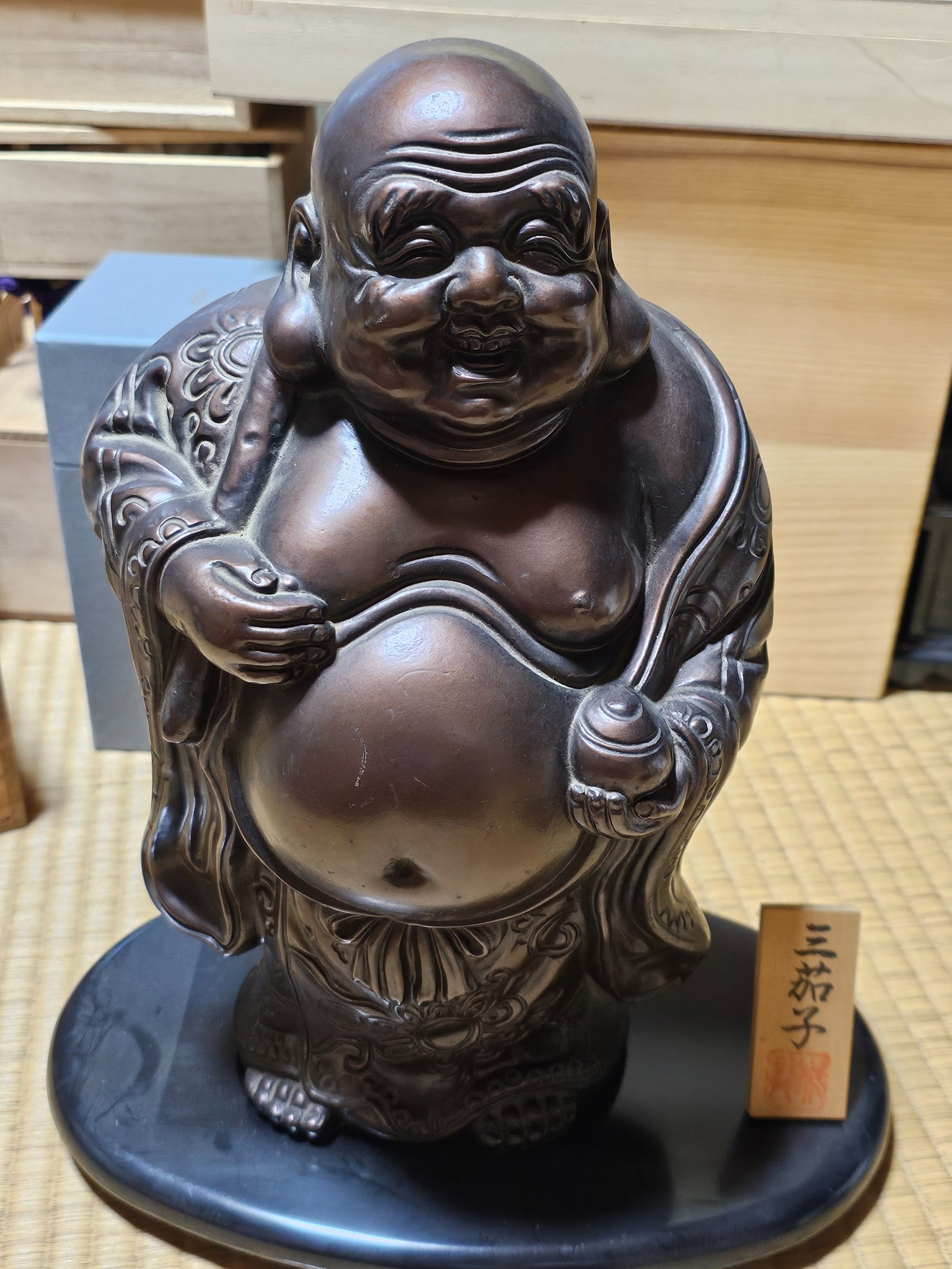 Hotei laughing fortune figure from the Hanasaki house.