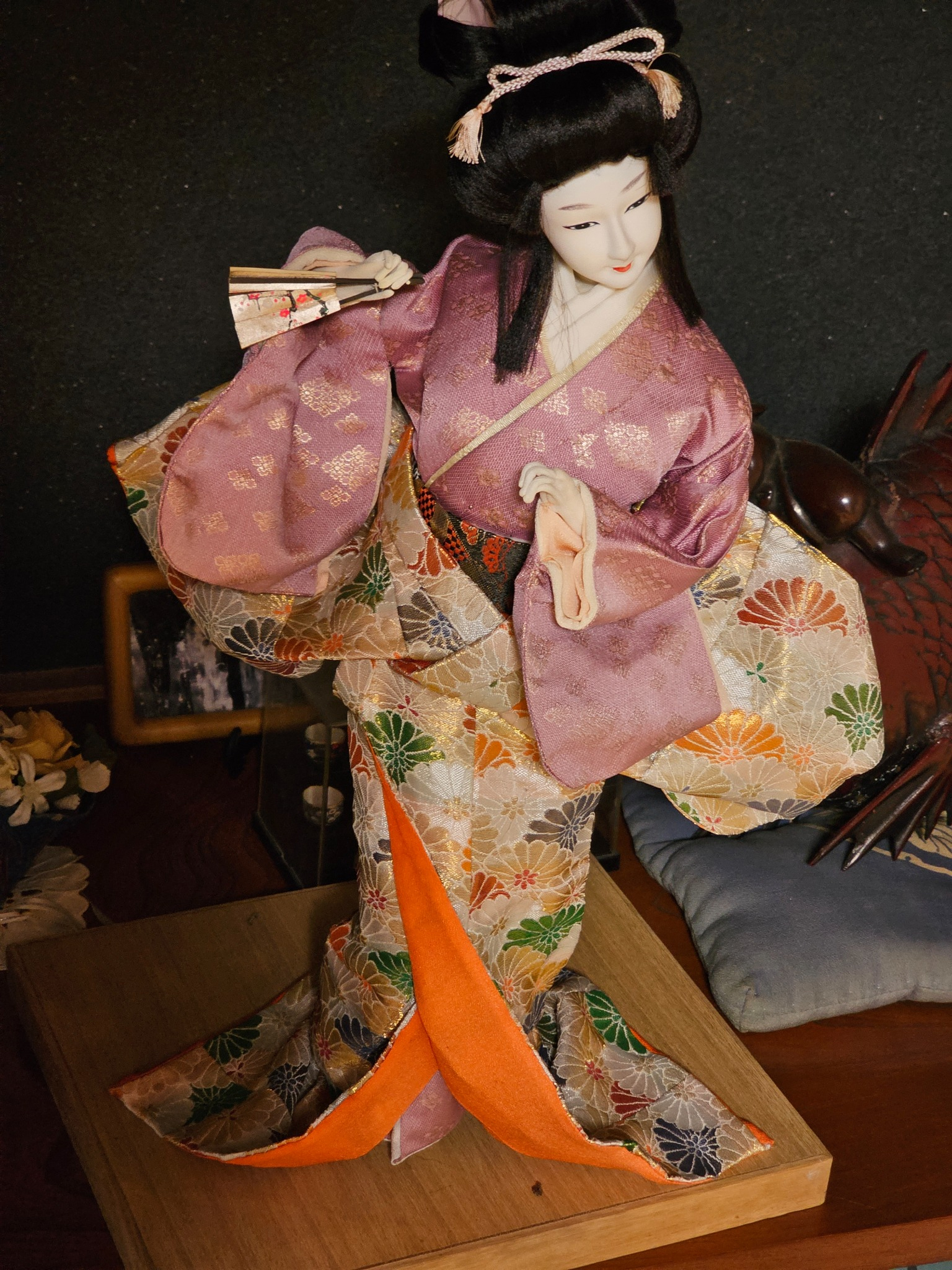 Japanese dancing doll in purple kimono.