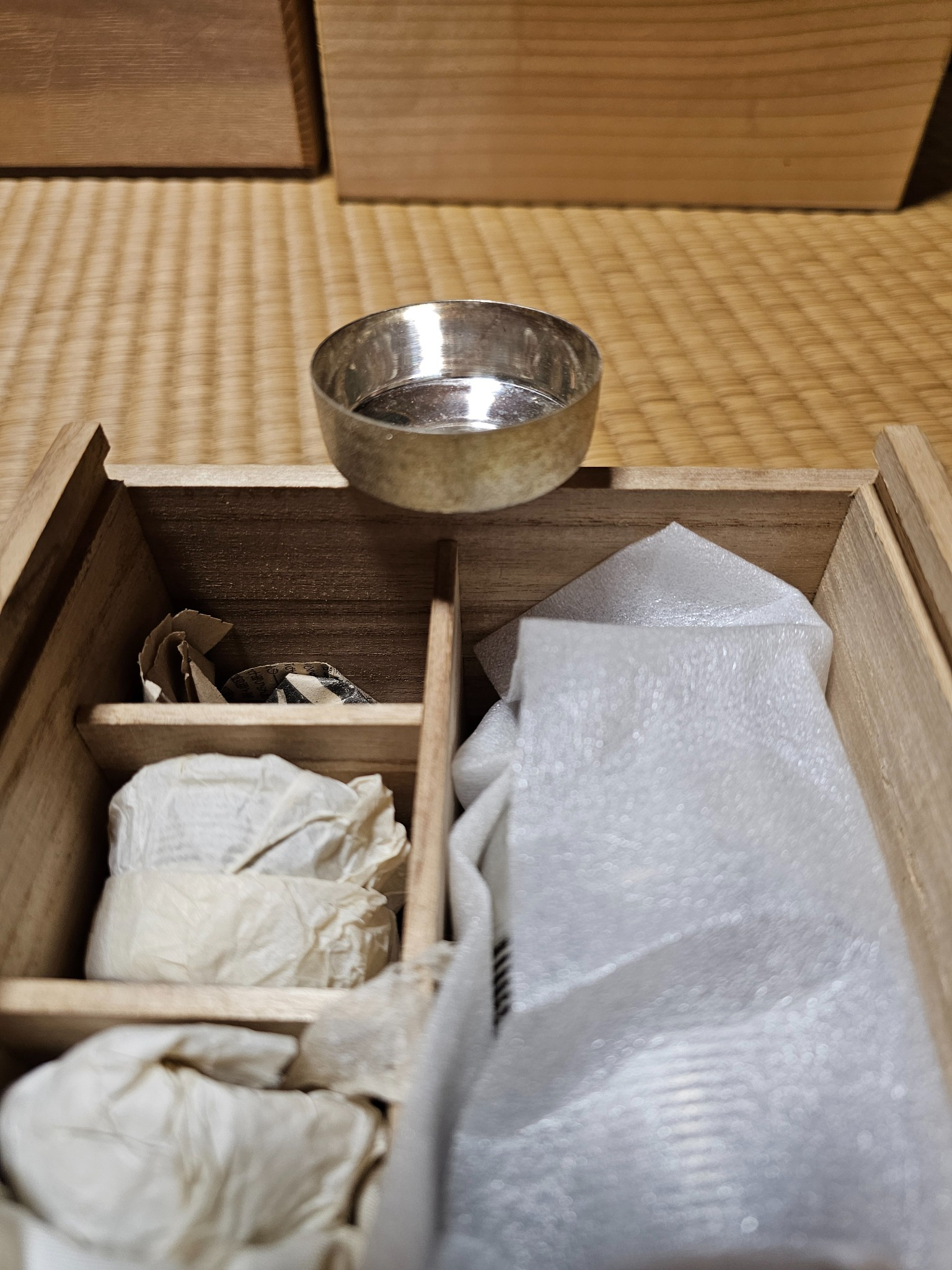 Silver sake set in its box from the Hanasaki house.