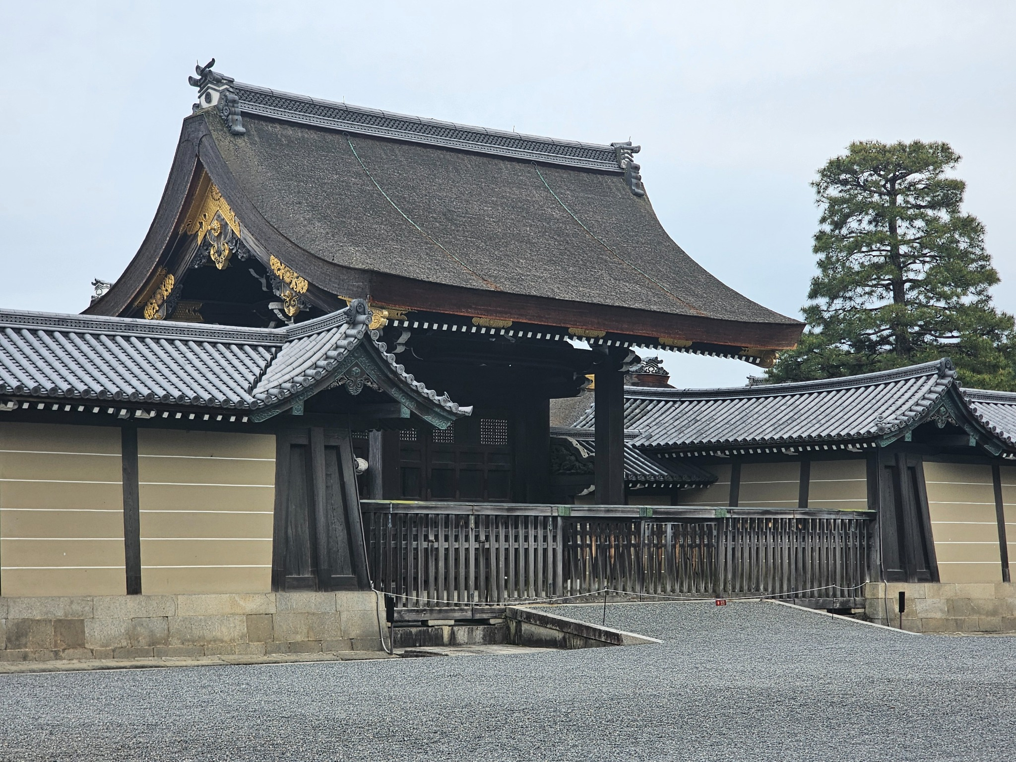 Grand Kyoto gate with thatched roof.