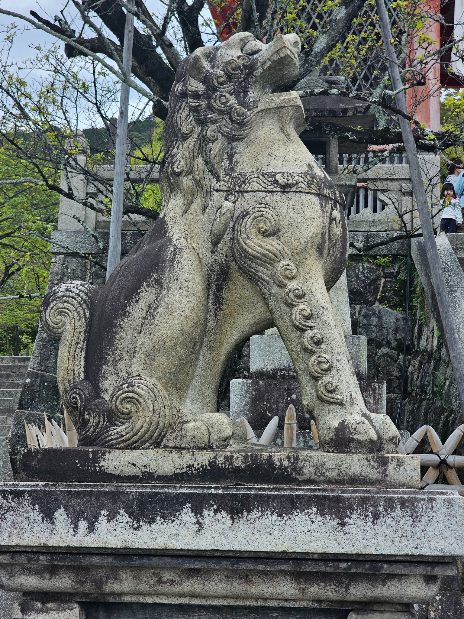 Weathered guardian lion in Kyoto.