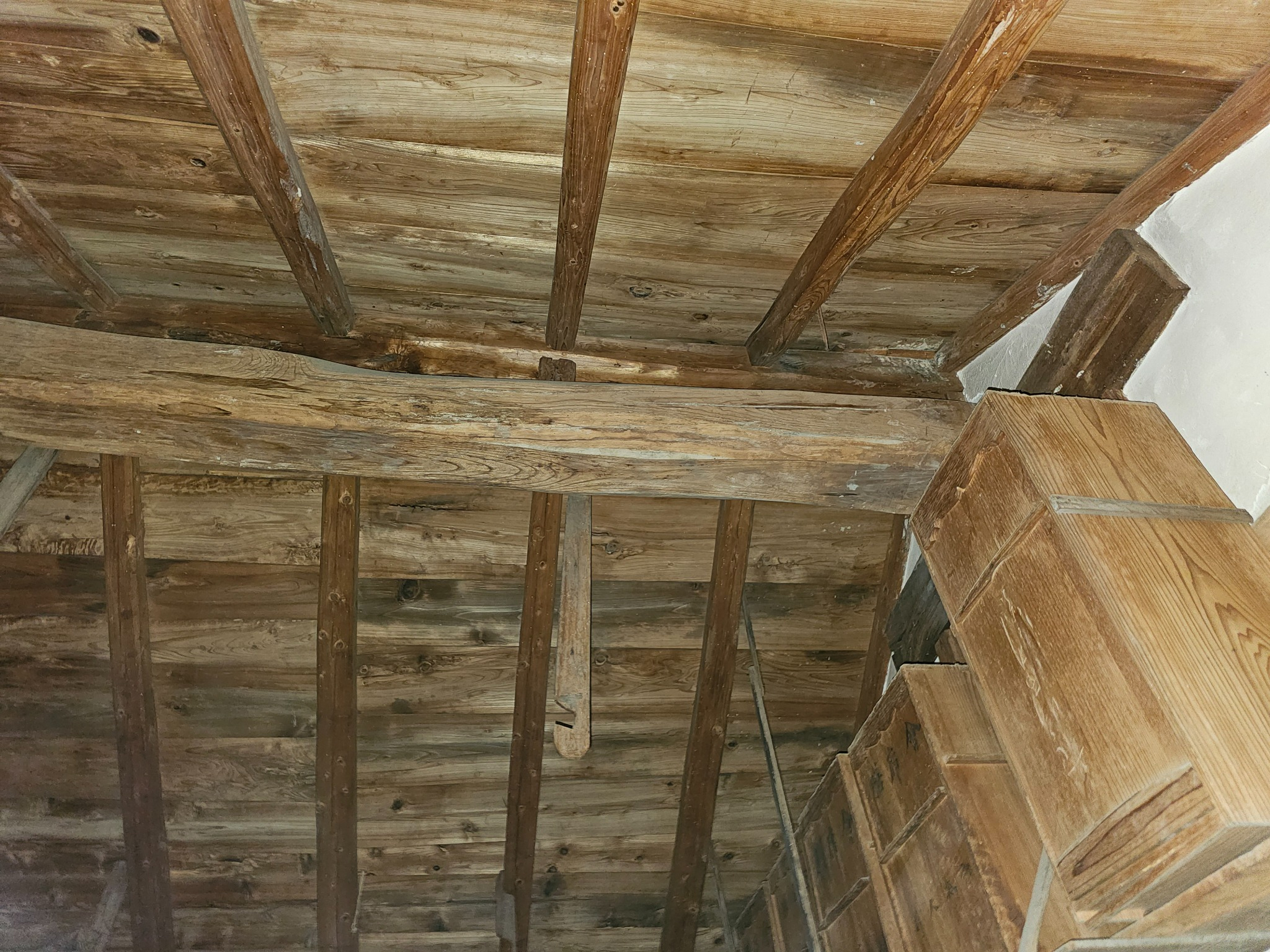 Wide interior view of the Hanasaki kura with beams.