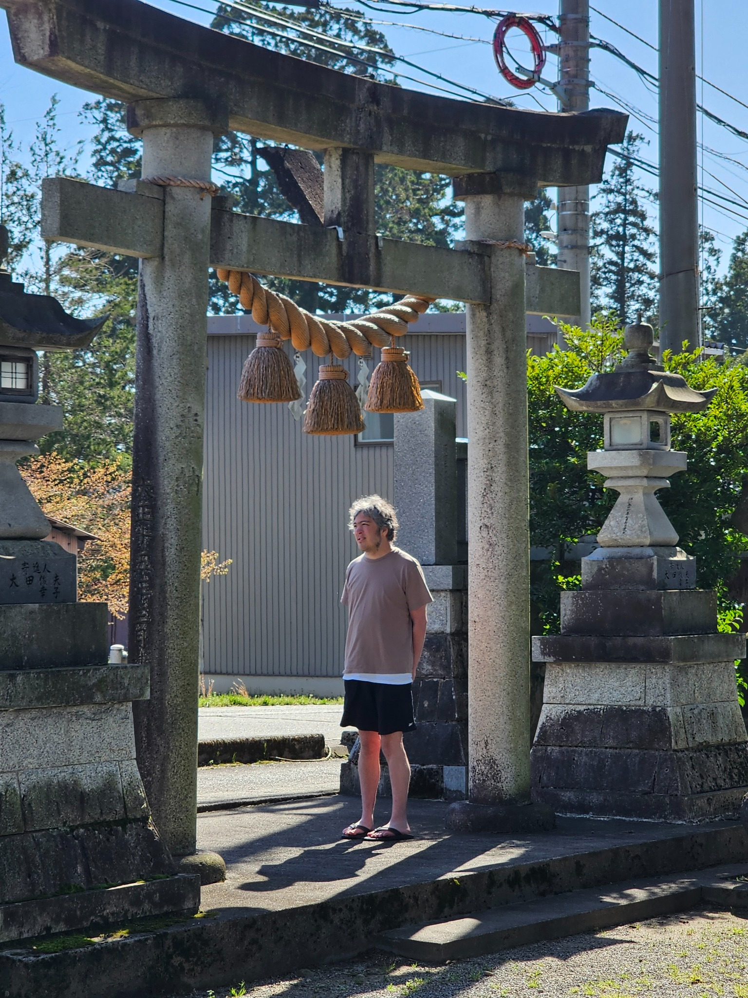 Bradley and Tatsunari under the Hanasaki Shrine torii.