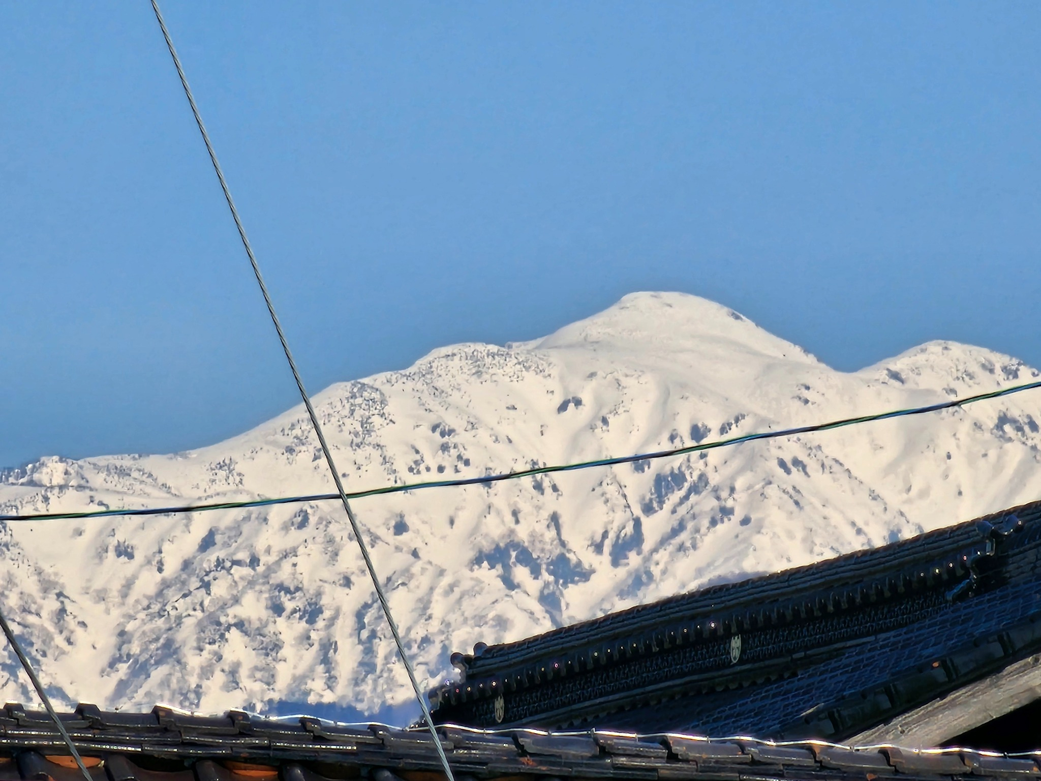 A close view of a snow-covered peak near Hanasaki.
