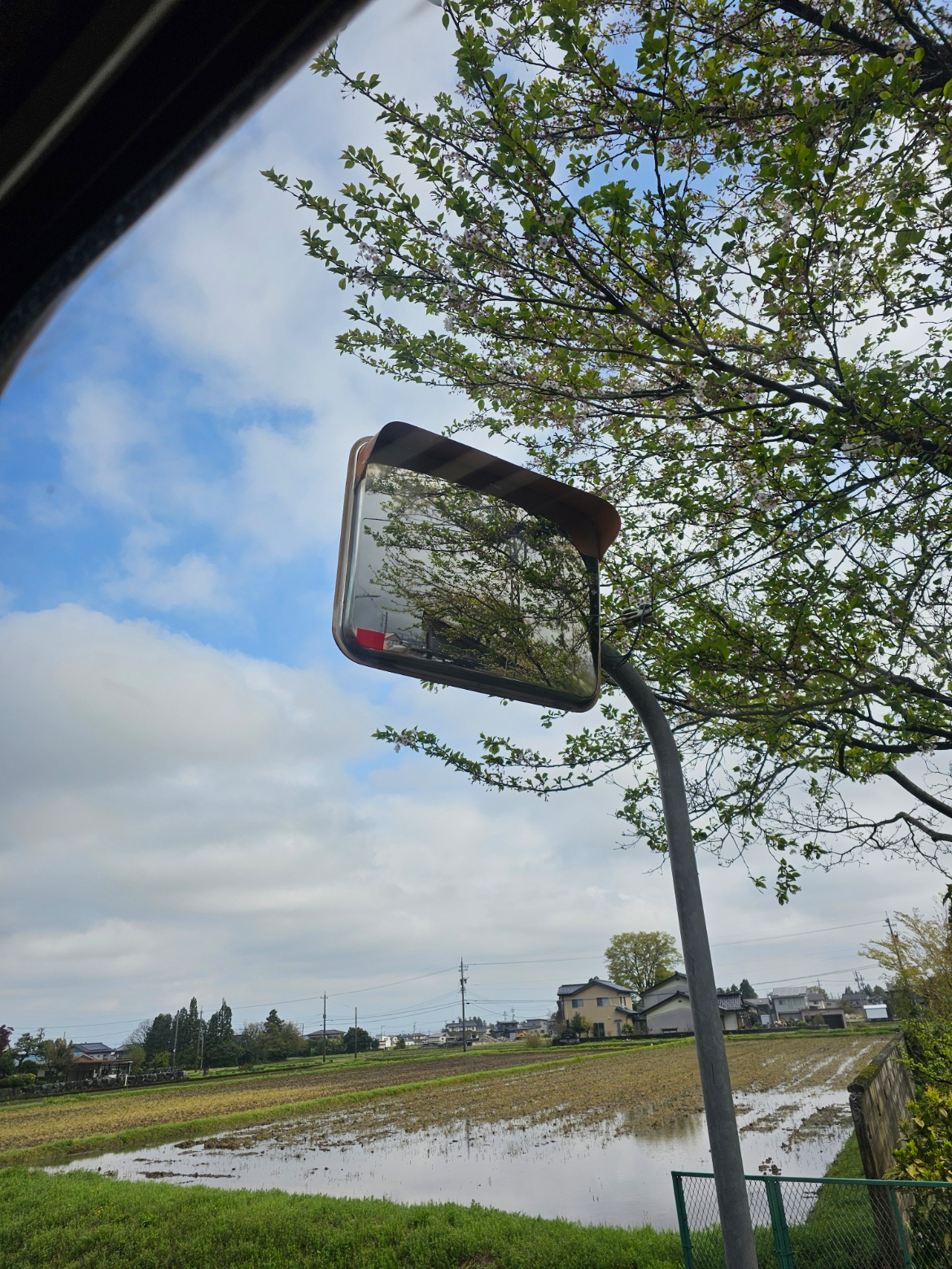 Roadside mirror over the rice fields near Hanasaki.