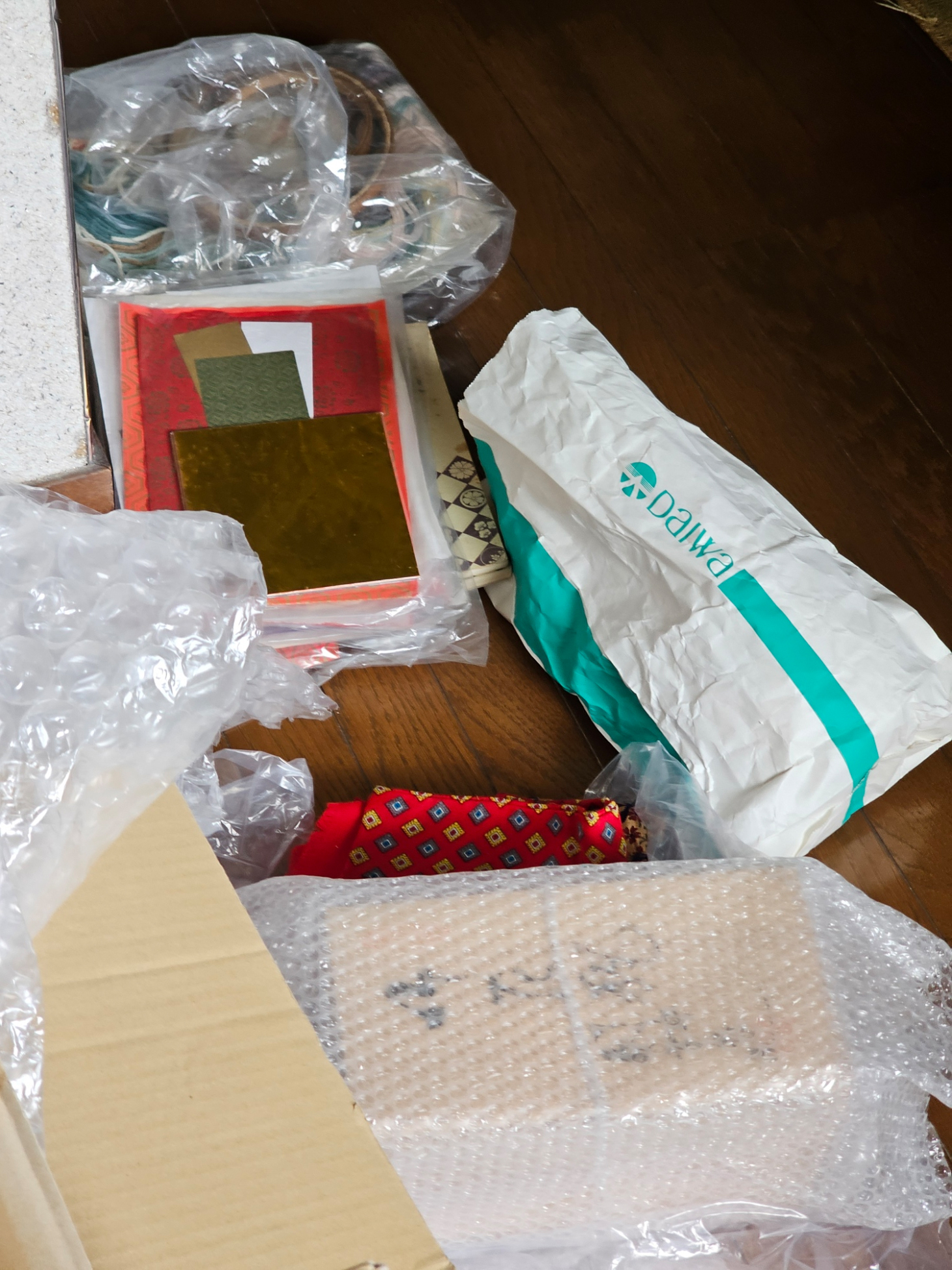 Packed objects and shipping materials in the Hanasaki house.