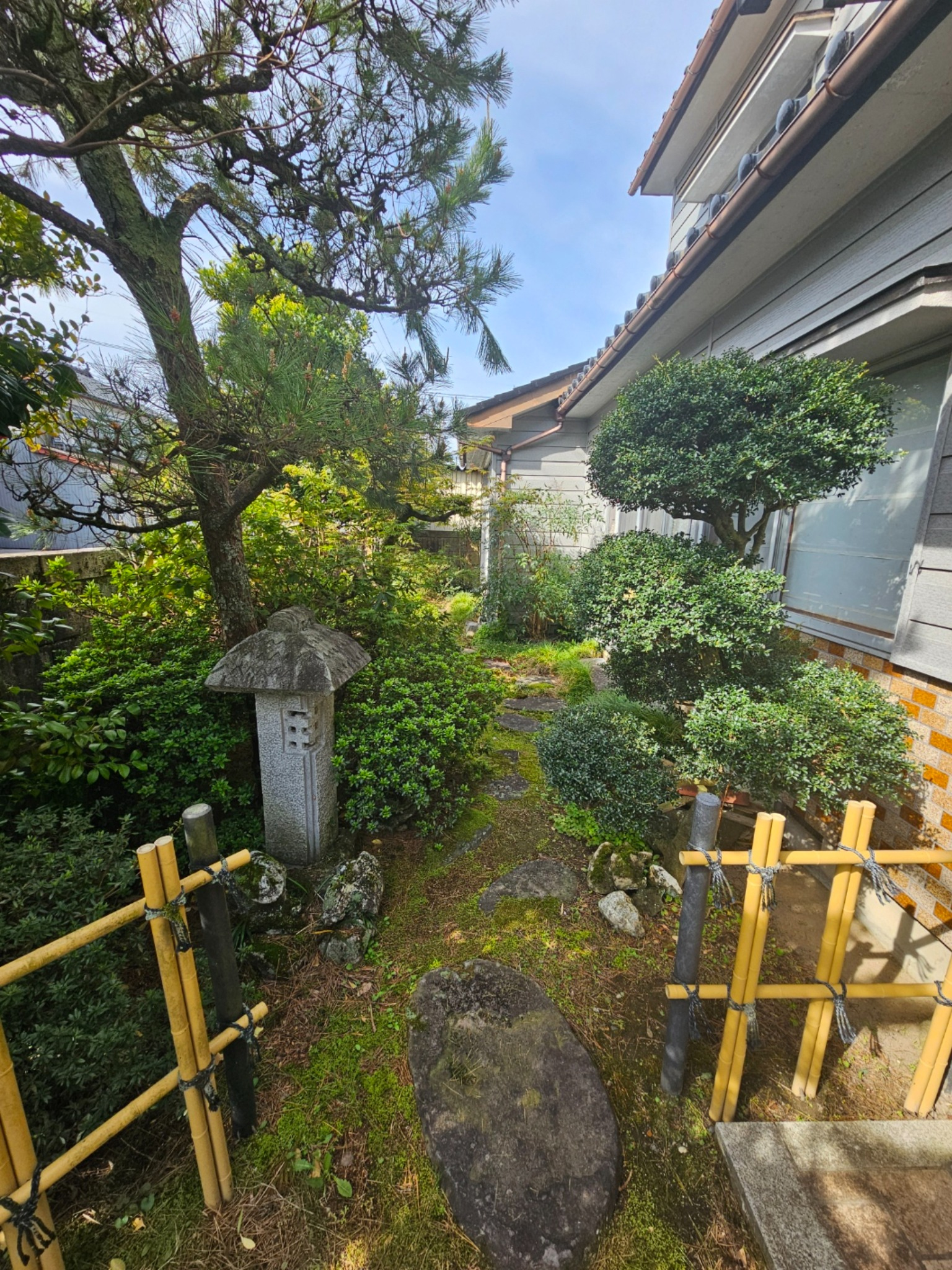 Stone lantern in the front garden of the Hanasaki house.