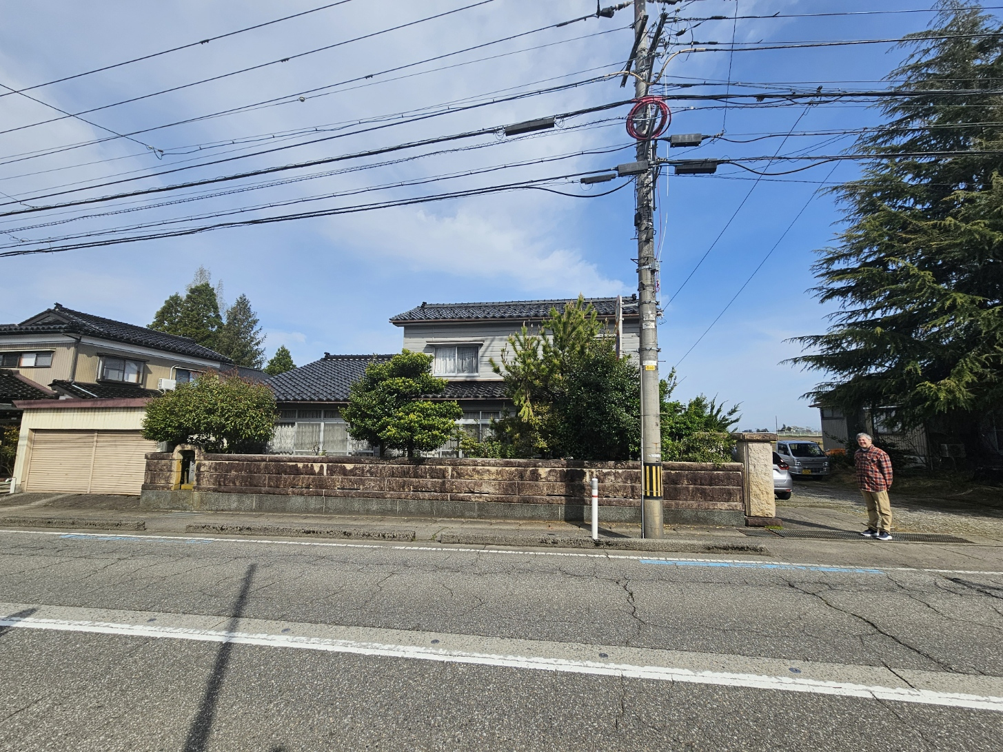 The house seen across the street with Brad.