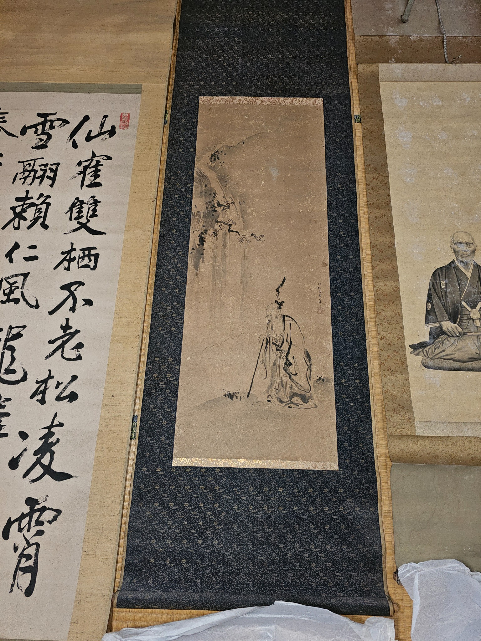 Ancient man with mountain scroll.