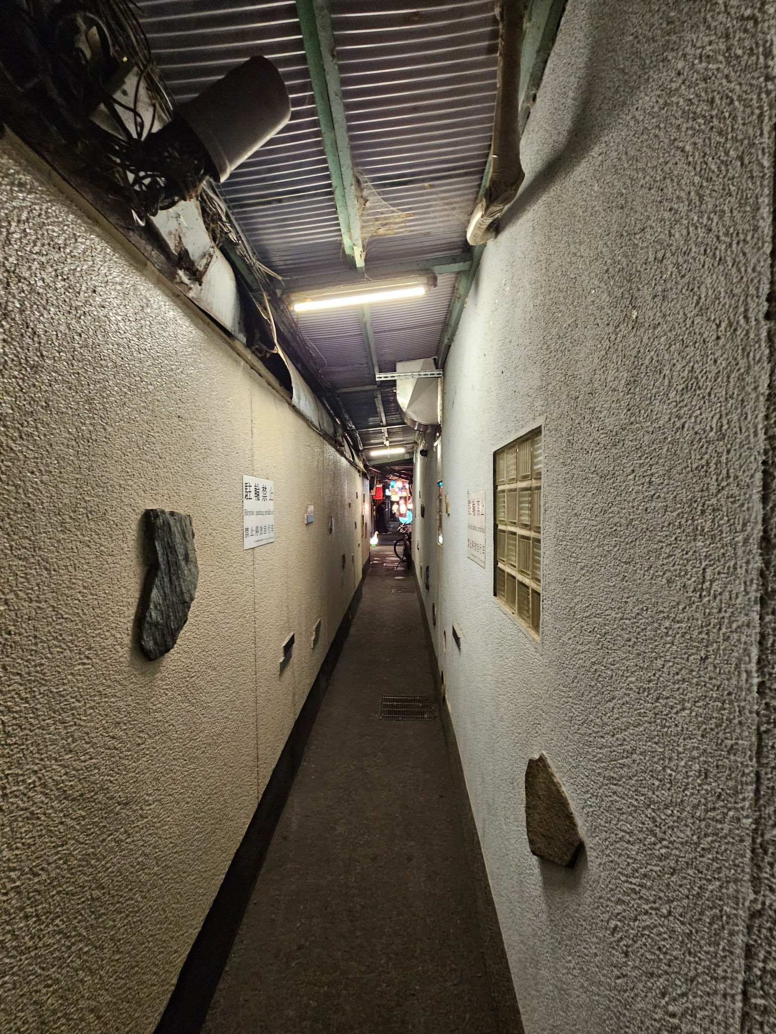 Narrow night passageway in Kyoto.