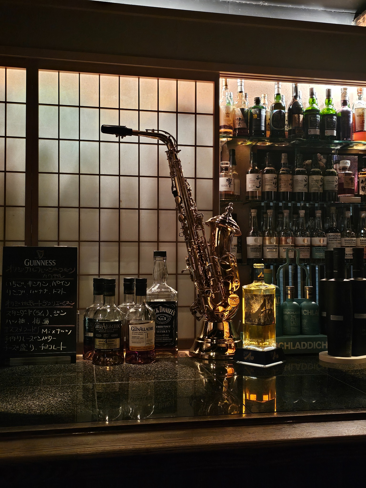 Saxophone and whisky backbar in Kyoto.