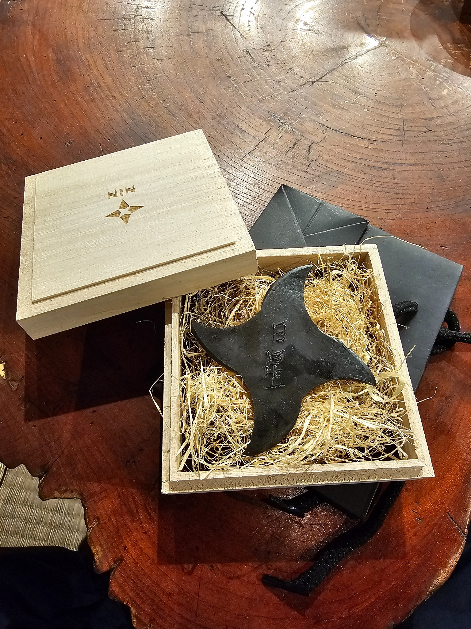 Shuriken in wooden box.