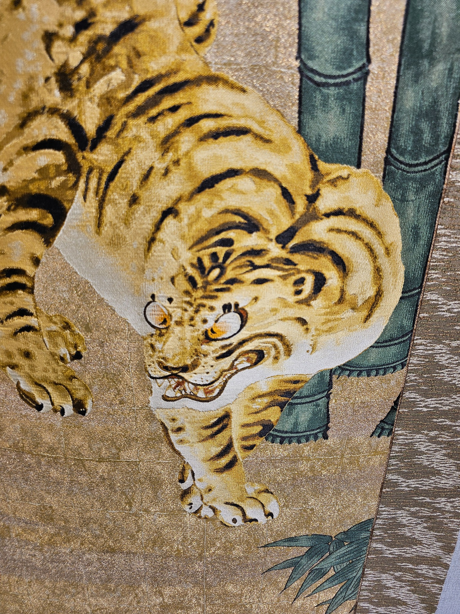 Close detail of the tiger scroll.