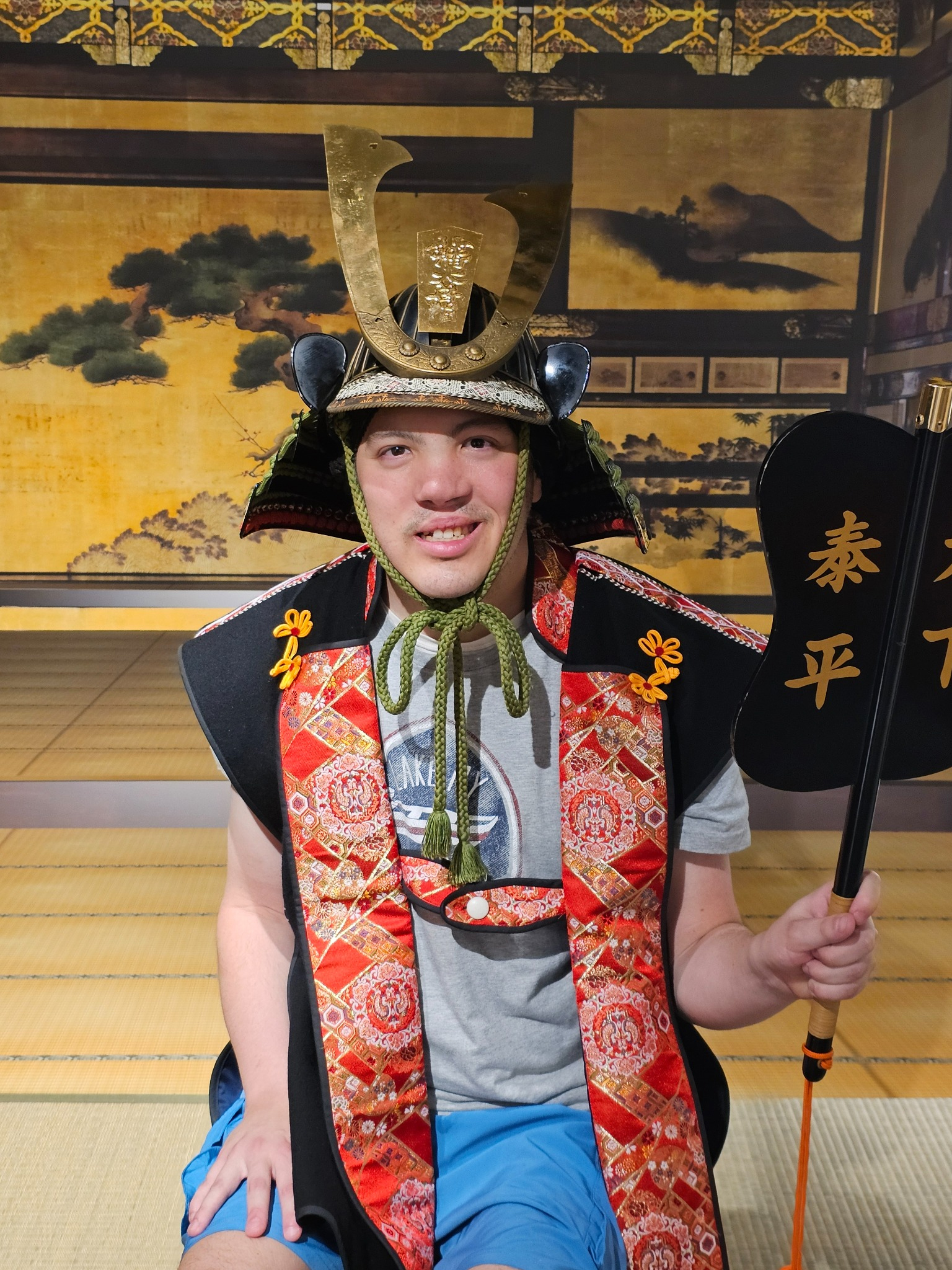 Young man in samurai helmet.